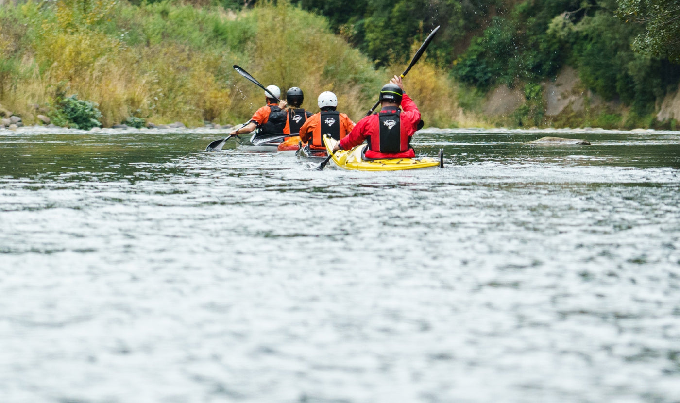 Multisport kayakers on Grade 2 Kayak Course in North Island New Zealand